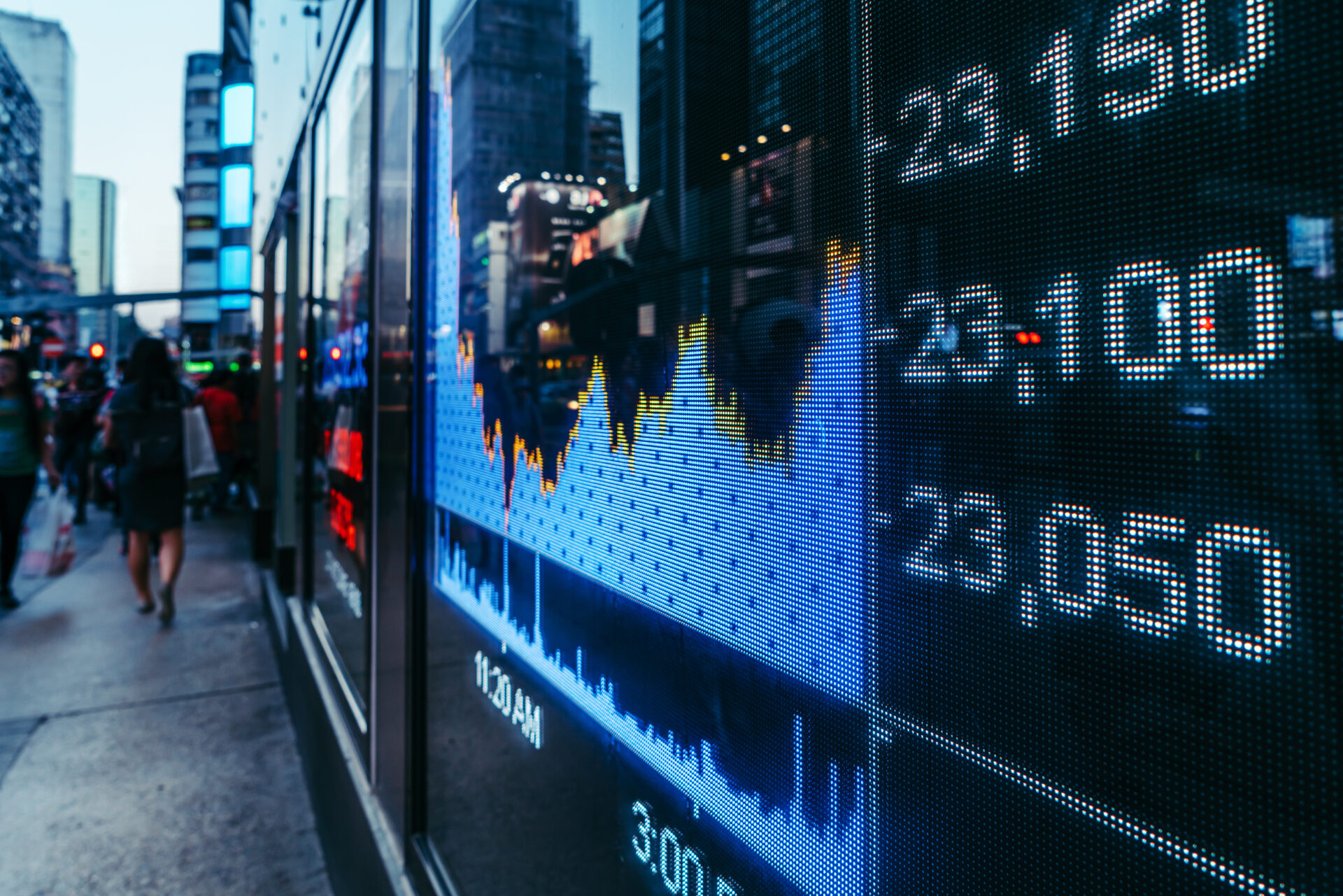 Display stock market numbers with defocused street lights background